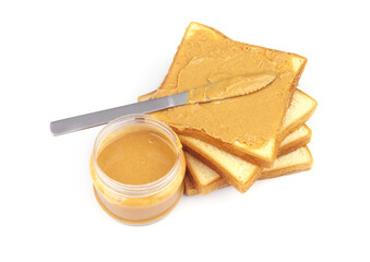 White bread slices with peanut butter spread and table knife isolated on white background