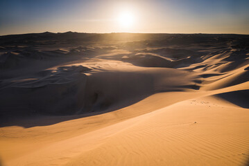 Fototapeta na wymiar Sand dunes in the desert at sunset, Huacachina, Ica Region, Peru, South America