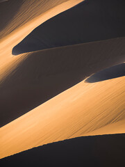 Fototapeta na wymiar Sand dune patterns at sunset in the desert, Huacachina, Ica Region, Peru, South America