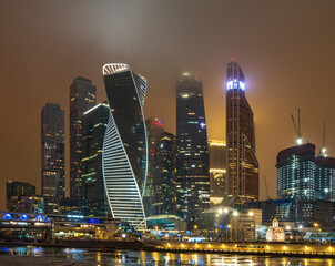 Fototapeta na wymiar Moscow city at winter night. Modern skyscrapers in Moscow-city downtown. Moscow, Russia