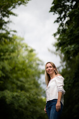 Portrait of a relaxed middle aged woman outdoors, looking happy, enjoying the life