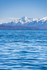 Cordillera Real Mountain Range (part of Andes Mountains) behind Lake Titicaca, seen from Isla del Sol, Bolivia, South America