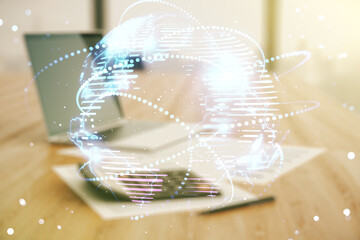 Abstract graphic digital world map hologram with connections on blurry calculator and computer...