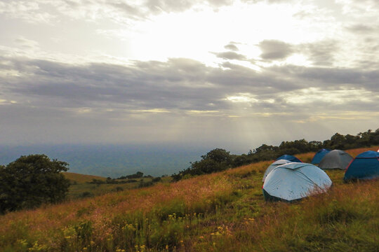 Scenic view of camping tents in the wild against mountains at Chyulu National Park, Kenya