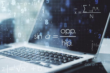 Double exposure of creative scientific formula concept on laptop background, research and development concept