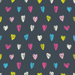 Simple seamless pattern with hearts on a black background.