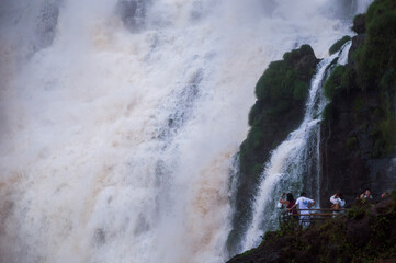Tourists at Salto Bossetti Waterfall, Iguazu Falls (aka Iguassu Falls or Cataratas del Iguazu), Misiones Province, Argentina, South America