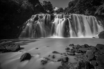 Fototapeta na wymiar Waterfall connecting a tributary with the Rio Parana (Parana River), near Puerto Iguazu, Misiones Province, Argentina, South America