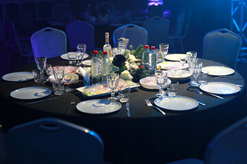 festive decorated table with crockery at the event 