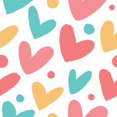 Simple seamless pattern with hearts and polka dots in pastel colors.