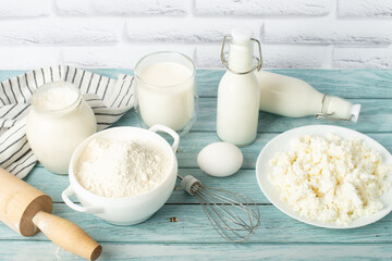 Fresh ingredients for baking a delicious homemade cake, pie on a blue wooden table