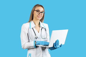 beautiful doctor woman holding laptop on smooth background, studio photo shot . concept of telemedicine