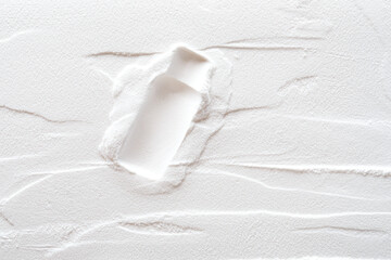 Artistic background, texture of sand and plaster with bottle print. Color white
