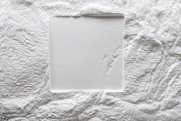 Artistic background, texture of sand and plaster with square print. Color white