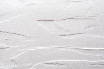 Artistic texture background of sand and plaster. Color white
