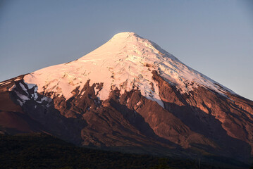Fototapeta premium Sunset at Osorno Volcano, Vicente Perez Rosales National Park, Chilean Lake District, Chile, South America