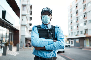 I put the pro in protect. Portrait of a confident masked young security guard standing guard outdoors.