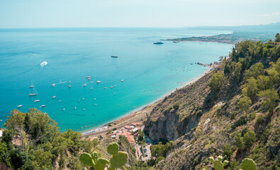 Obraz premium High view of turquoise Mediterranean sea in Taormina, Sicily, Italy during a summer day