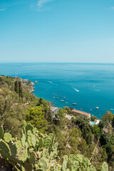 Fototapeta na wymiar High view of turquoise Mediterranean sea in Taormina, Sicily, Italy during a summer day