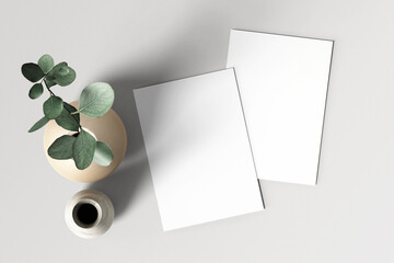 Blank white poster flyer on a grey background