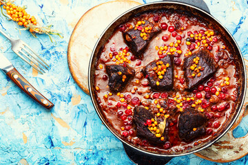 Meat stewed in autumn berries.