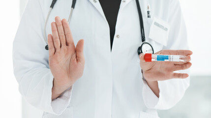 Heres five reason why you should get vaccinated. Cropped shot of a medical practitioner holding up a vial with coronavirus vaccine on it.