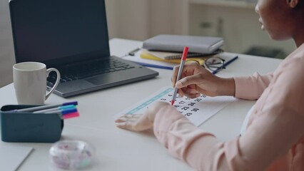 Female freelancer marking days in calendar, waiting for important date, meeting