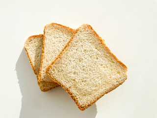 Sliced toast bread isolated on white background. Fresh bread for breakfast. Top view.