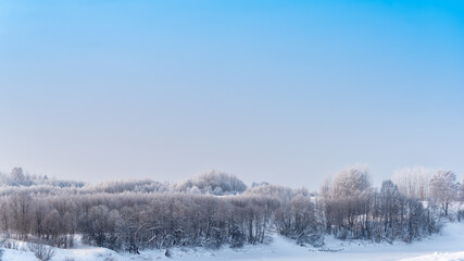 Fototapeta na wymiar Landscape with winter forest covered with snow. 