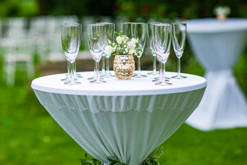Waiter holding a lot champagne glasses