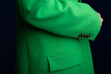 Close up image of fashionable green blazers on a woman. Woman's fashion classic jacket in details....