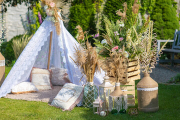 Street decorations prepared for a birthday, wigwam in summer green garden © sichkarenko_com