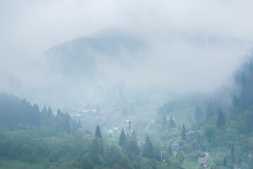 Misty Romanian forest landscape around Sucevita Monastery, Bukovina Region, Romania