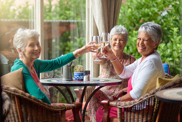 Heres to friendship that lasts a lifetime. Cropped shot of a group of senior female friends...