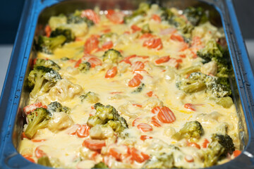 Chicken cooked with vegetables and potatoes.