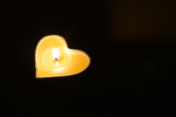 heart formed candle and its shadow