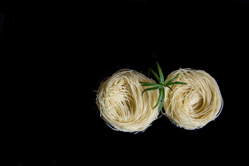 Raw pasta with dark background