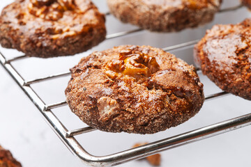 Homemade cookies on a metal grill on a gray background