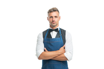 Confident waiter in apron and bow keeping arms crossed isolated on white, servant