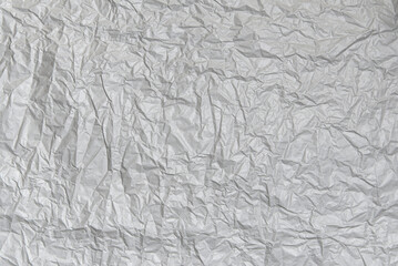 Crumpled gray paper texture. Abstract blank background for design.