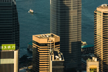 Boats in Victoria Harbour at sunset, seen from Victoria Peak, Hong Kong Island, Hong Kong, China