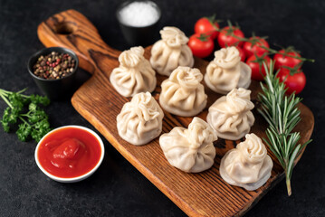 Khinkali, Georgian dumplings with meat filling on a stone background