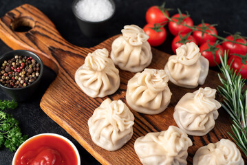 Khinkali, Georgian dumplings with meat filling on a stone background