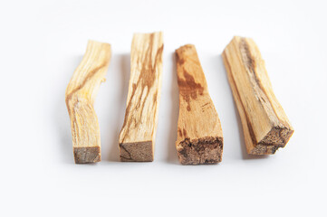 Palo Santo bars close-up and copy space. Ritual cleansing with sacred ibiocai, meditation, aromatherapy with incense and candles..