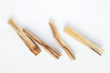 Palo Santo bars close-up and copy space. Ritual cleansing with sacred ibiocai, meditation, aromatherapy with incense and candles..