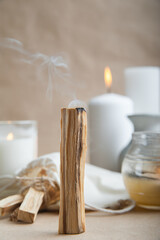 Palo Santo bars close-up and copy space. Ritual cleansing with sacred ibiocai, meditation, aromatherapy with incense and candles..