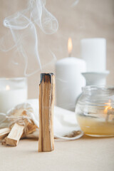 Palo Santo bars close-up and copy space. Ritual cleansing with sacred ibiocai, meditation, aromatherapy with incense and candles..