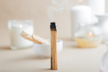 Palo Santo bars close-up and copy space. Ritual cleansing with sacred ibiocai, meditation, aromatherapy with incense and candles..