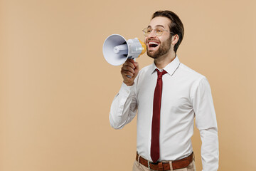 Young successful employee business man corporate lawyer 20s in white shirt red tie glasses work in office hold scream in megaphone announces discounts sale Hurry up isolated on plain beige background.