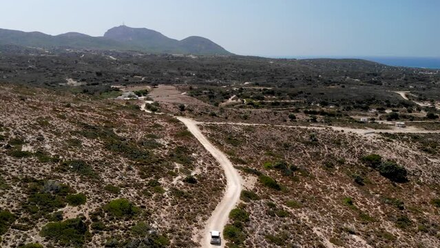 Aerial view of a car driving on a dirt road on Kos island